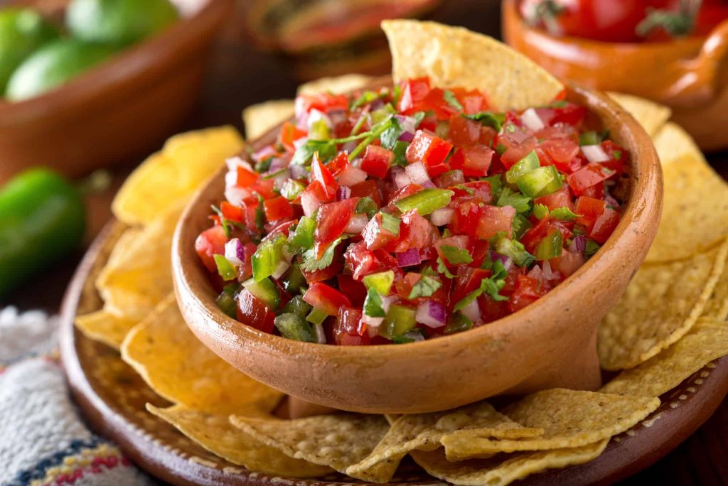 delicious homemade pico de gallo in a bowl with tortilla chips