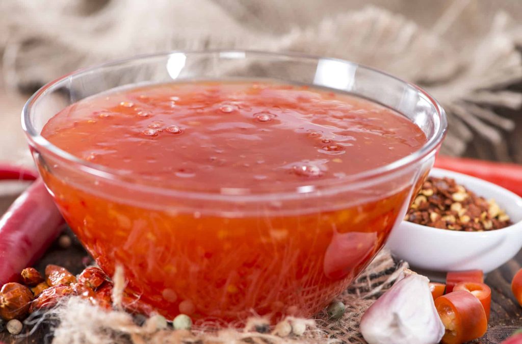 Fresh homemade Chili sauce with herbs and spices