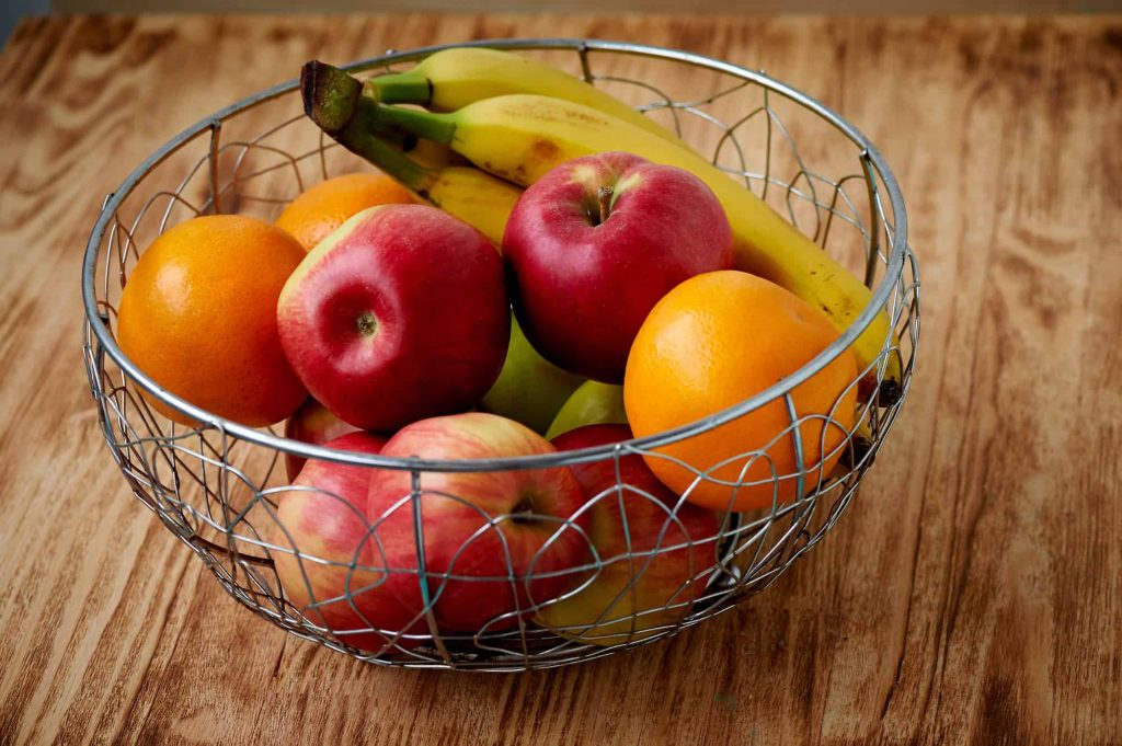 fresh fruits on a wooden table