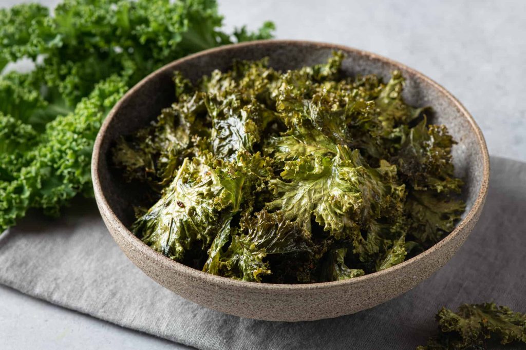 Kale chips in a ceramic bowl