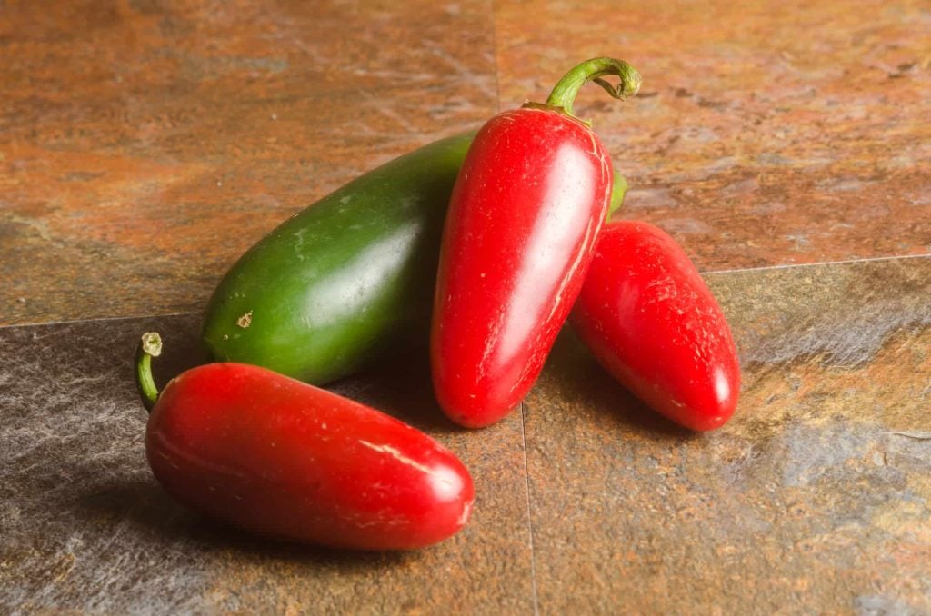 red jalapenos on a table